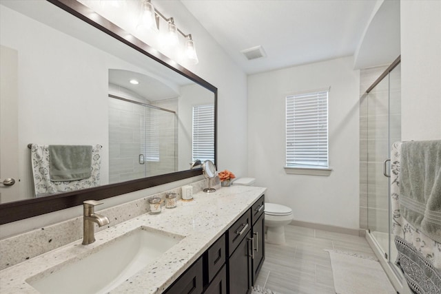 1685 Daylight Lake Dr, Katy, TX 77493 - bathroom with vanity, a shower stall, toilet, tile patterned floors, and recessed lighting