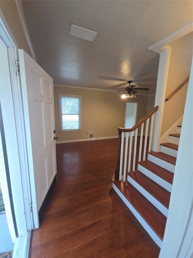 301 Harold St, Crockett, TX 75835 - foyer entrance featuring wood finished floors, stairway, ceiling fan, baseboards, and crown molding