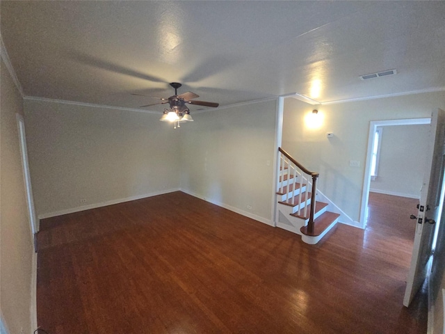 301 Harold St, Crockett, TX 75835 - unfurnished room featuring ornamental molding, wood finished floors, a ceiling fan, stairs, and baseboards