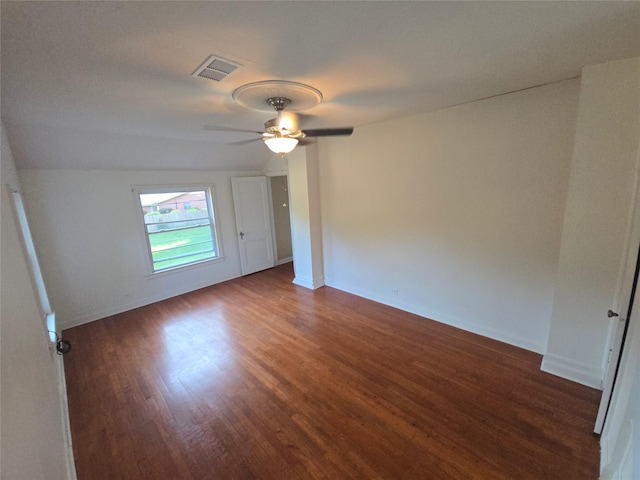301 Harold St, Crockett, TX 75835 - unfurnished room featuring dark wood-style flooring, a ceiling fan, and baseboards