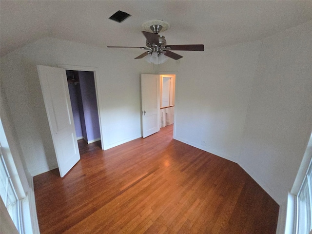 301 Harold St, Crockett, TX 75835 - unfurnished bedroom with wood finished floors, vaulted ceiling, a ceiling fan, and a closet