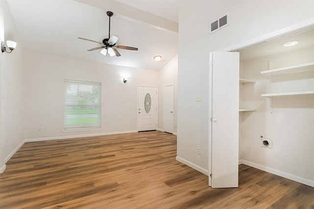 12626 Marble Dr, Houston, TX 77070 - washroom with a ceiling fan, hookup for an electric dryer, wood finished floors, baseboards, and a towering ceiling