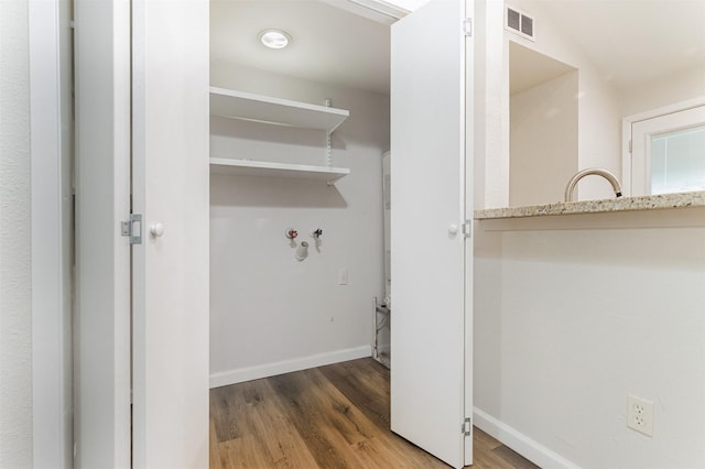 12626 Marble Dr, Houston, TX 77070 - washroom with wood finished floors and baseboards