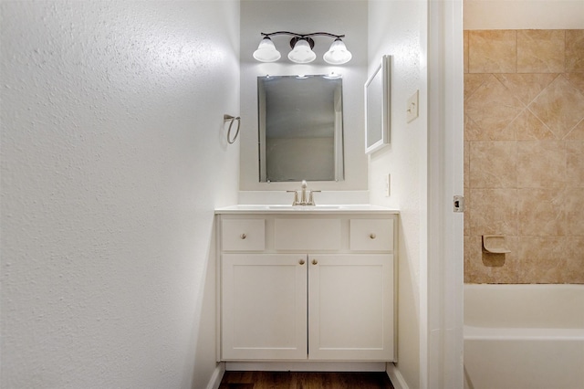 12626 Marble Dr, Houston, TX 77070 - bathroom with vanity, shower / bathtub combination, and a textured wall