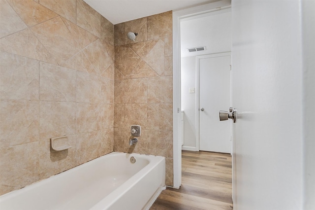 12626 Marble Dr, Houston, TX 77070 - bathroom featuring  shower combination and wood finished floors