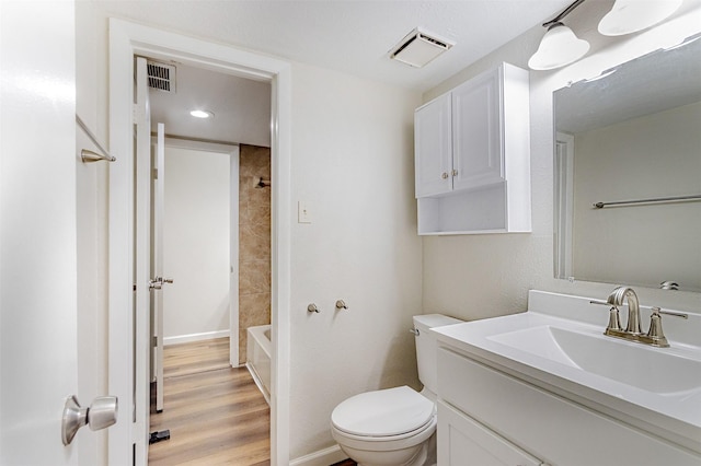 12626 Marble Dr, Houston, TX 77070 - full bath with vanity, toilet, wood finished floors, and baseboards