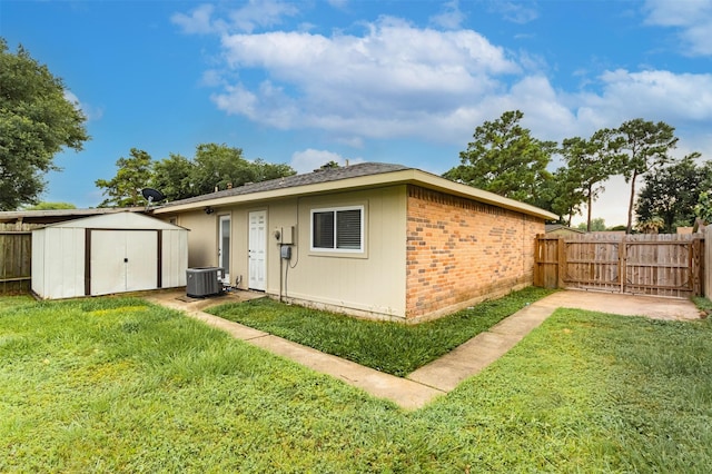 12626 Marble Dr, Houston, TX 77070 - rear view of property featuring cooling unit and brick siding