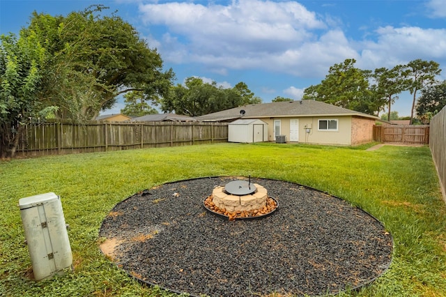 12626 Marble Dr, Houston, TX 77070 - view of yard with a fire pit and central AC