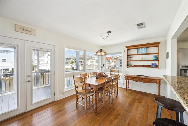 3411 Petite Cir, Galveston, TX 77554 - dining room with hardwood / wood-style floors and french doors