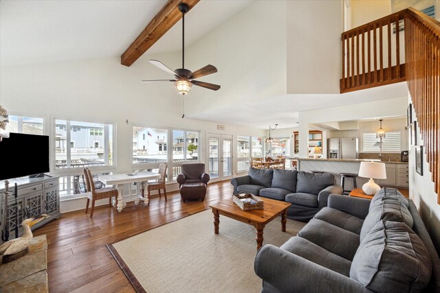 3411 Petite Cir, Galveston, TX 77554 - living room featuring high vaulted ceiling, wood-type flooring, a ceiling fan, and beam ceiling