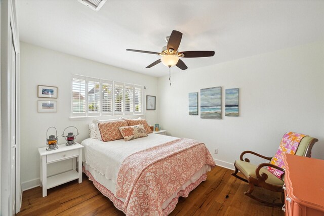 3411 Petite Cir, Galveston, TX 77554 - bedroom with wood finished floors and a ceiling fan