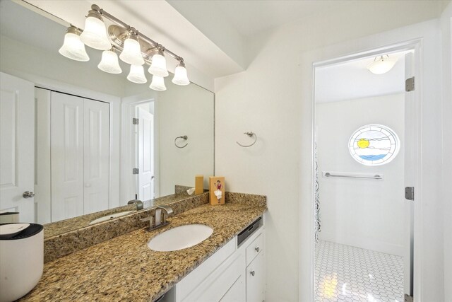 3411 Petite Cir, Galveston, TX 77554 - bathroom with vanity, tile patterned floors, and a shower with shower curtain