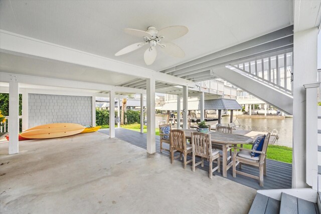 3411 Petite Cir, Galveston, TX 77554 - view of patio / terrace featuring a ceiling fan, outdoor dining space, and a water view