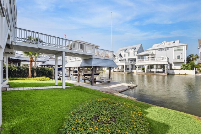 3411 Petite Cir, Galveston, TX 77554 - dock with a lawn, a water view, and boat lift