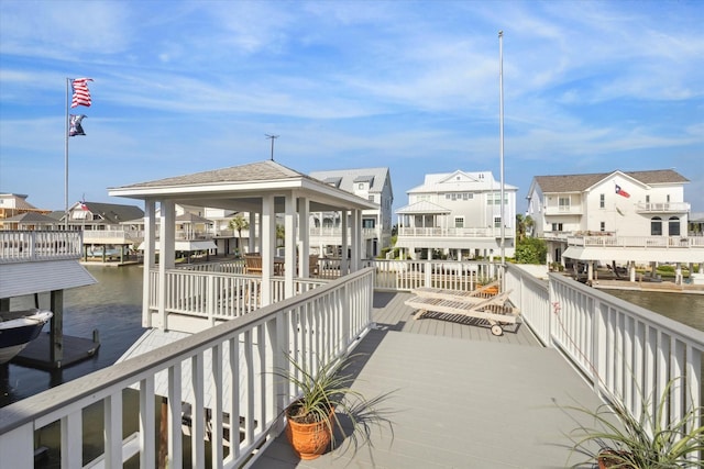 3411 Petite Cir, Galveston, TX 77554 - dock with a residential view, a water view, boat lift, and a gazebo