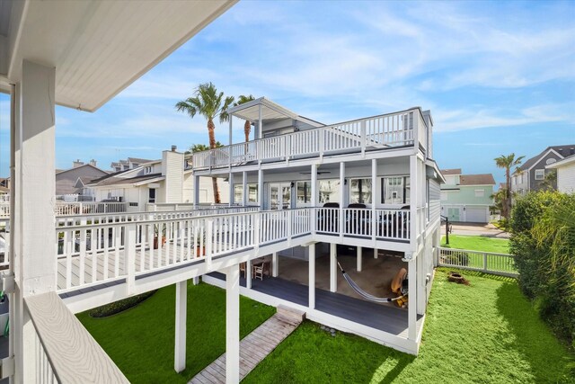 3411 Petite Cir, Galveston, TX 77554 - rear view of property with a residential view, a deck, and a balcony