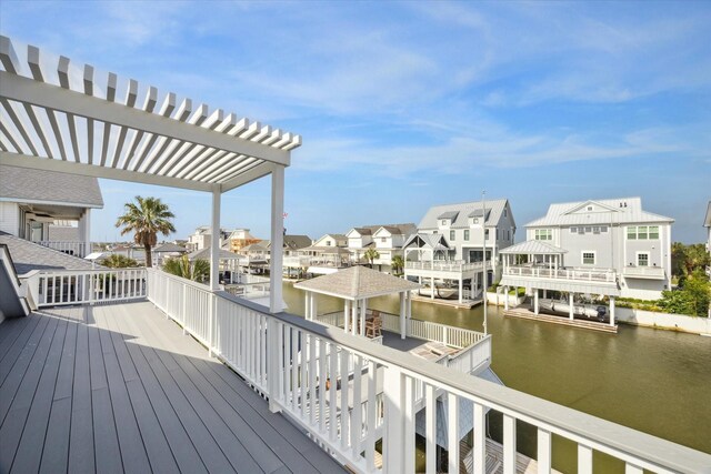 3411 Petite Cir, Galveston, TX 77554 - wooden deck featuring a residential view, a pergola, and a water view