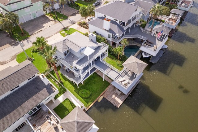 3411 Petite Cir, Galveston, TX 77554 - aerial view of residential area featuring a nearby body of water