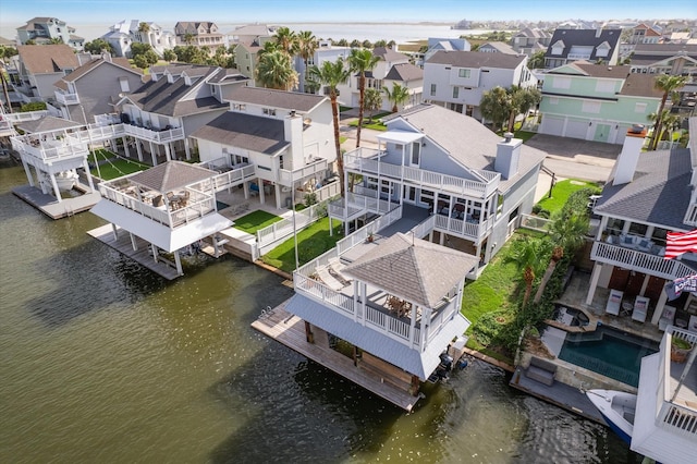 3411 Petite Cir, Galveston, TX 77554 - aerial view of residential area with a large body of water