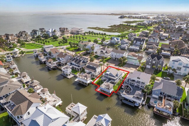 3411 Petite Cir, Galveston, TX 77554 - aerial perspective of suburban area with a nearby body of water and property parcel outlined