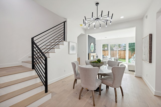 4309 Floyd St Unit B, Houston, TX 77007 - dining space featuring a chandelier, stairway, light wood-type flooring, recessed lighting, and baseboards