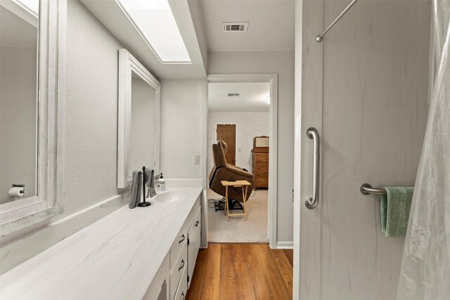 613 Bolling Green Dr, Wharton, TX 77488 - bathroom featuring vanity and wood finished floors