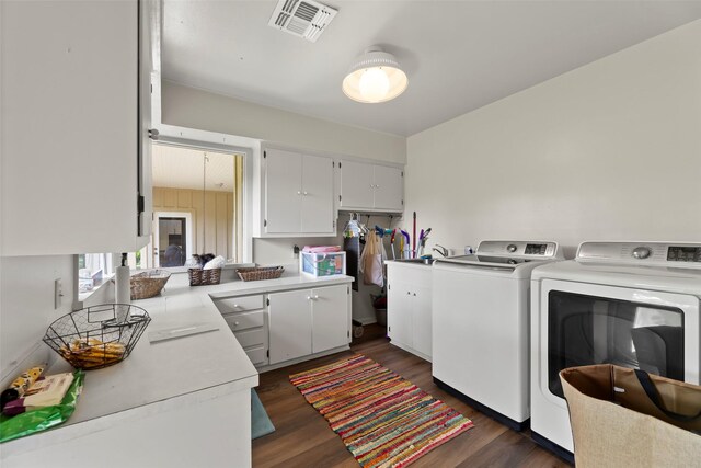 613 Bolling Green Dr, Wharton, TX 77488 - washroom with independent washer and dryer and dark wood finished floors