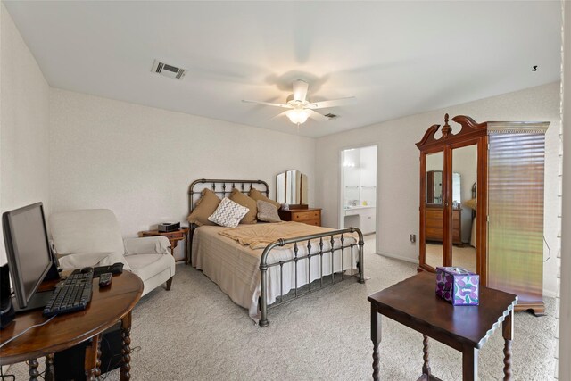 613 Bolling Green Dr, Wharton, TX 77488 - bedroom with light carpet, ceiling fan, and ensuite bathroom