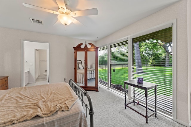 613 Bolling Green Dr, Wharton, TX 77488 - bedroom featuring access to outside, carpet floors, ensuite bath, and a ceiling fan