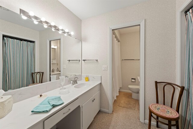613 Bolling Green Dr, Wharton, TX 77488 - full bath featuring toilet, vanity, and baseboards