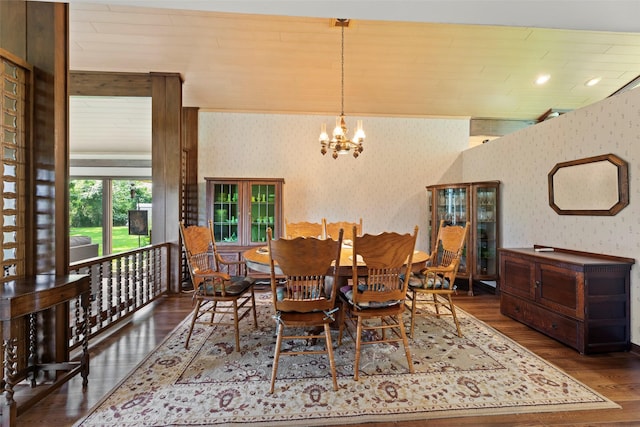 613 Bolling Green Dr, Wharton, TX 77488 - dining area with wallpapered walls, wood finished floors, and a chandelier