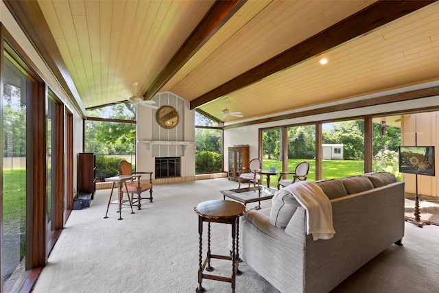 613 Bolling Green Dr, Wharton, TX 77488 - living area featuring carpet floors, ceiling fan, a tile fireplace, healthy amount of natural light, and wood ceiling