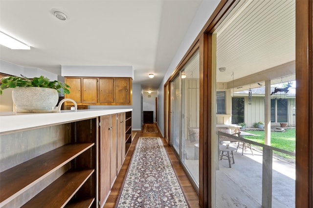 613 Bolling Green Dr, Wharton, TX 77488 - corridor featuring dark wood-type flooring