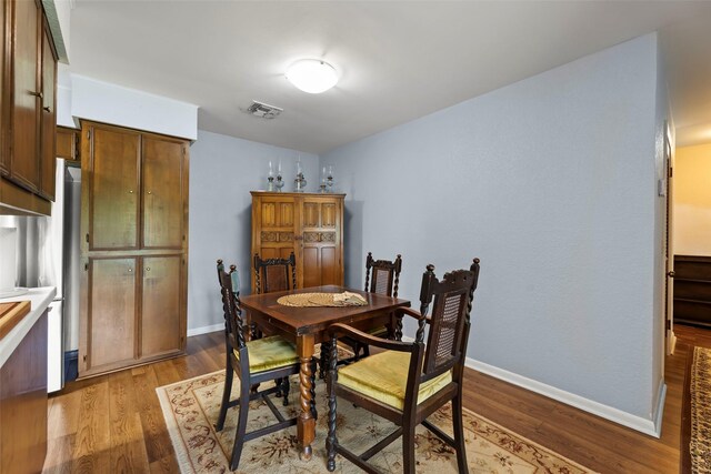 613 Bolling Green Dr, Wharton, TX 77488 - dining room featuring wood finished floors and baseboards