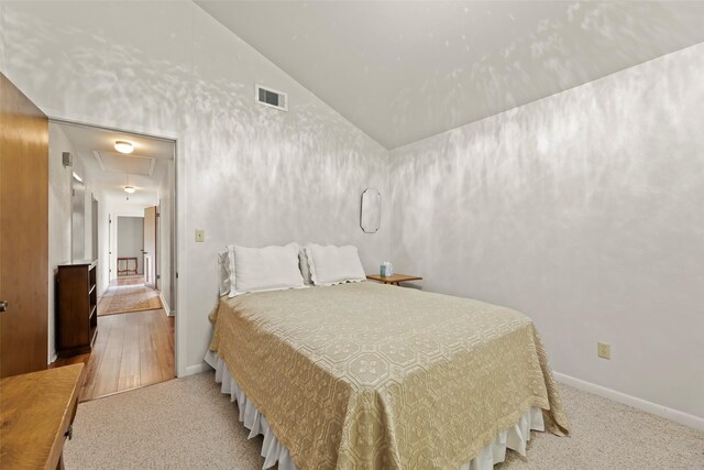 613 Bolling Green Dr, Wharton, TX 77488 - carpeted bedroom with attic access, vaulted ceiling, and baseboards