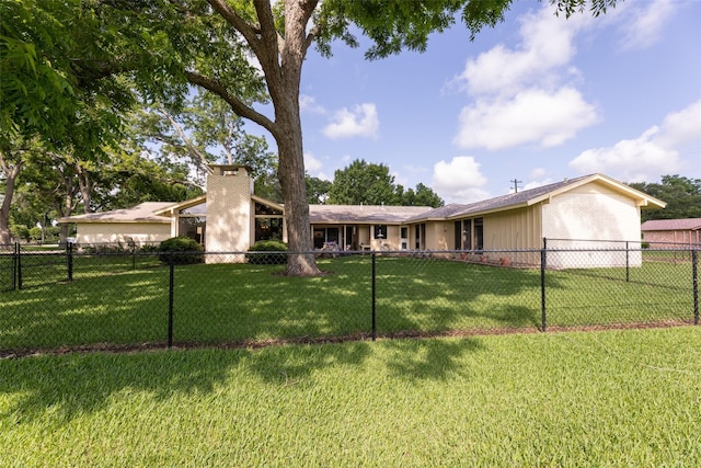 613 Bolling Green Dr, Wharton, TX 77488 - back of property with an attached garage and a chimney