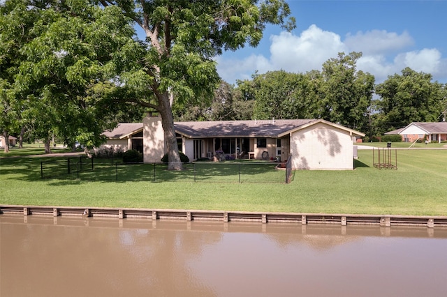 613 Bolling Green Dr, Wharton, TX 77488 - back of property with a water view and view of scattered trees