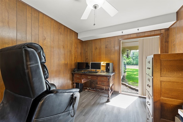 613 Bolling Green Dr, Wharton, TX 77488 - office space with wood walls, ceiling fan, and wood finished floors