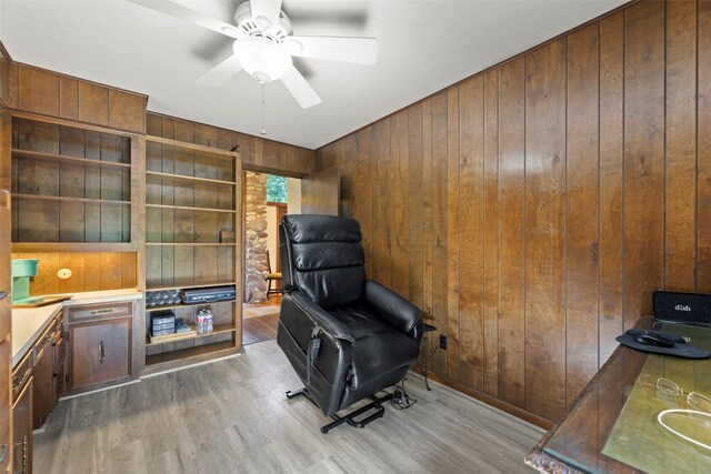 613 Bolling Green Dr, Wharton, TX 77488 - office space featuring wood walls, wood finished floors, and a ceiling fan