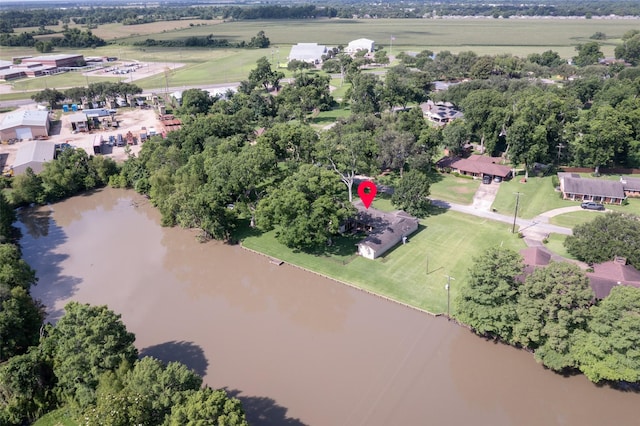 613 Bolling Green Dr, Wharton, TX 77488 - view of property location featuring a nearby body of water and a tree filled landscape