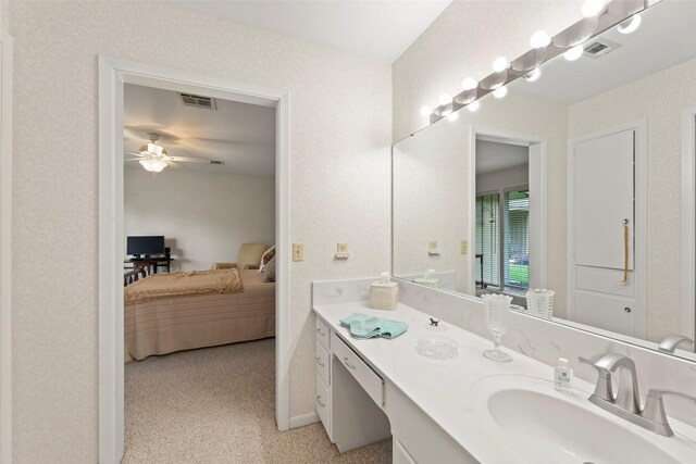 613 Bolling Green Dr, Wharton, TX 77488 - ensuite bathroom with ceiling fan, vanity, and baseboards