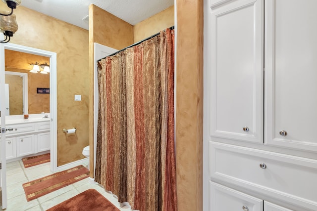15818 Conners Ace Dr, Spring, TX 77379 - bathroom with vanity, toilet, tile patterned flooring, and curtained shower