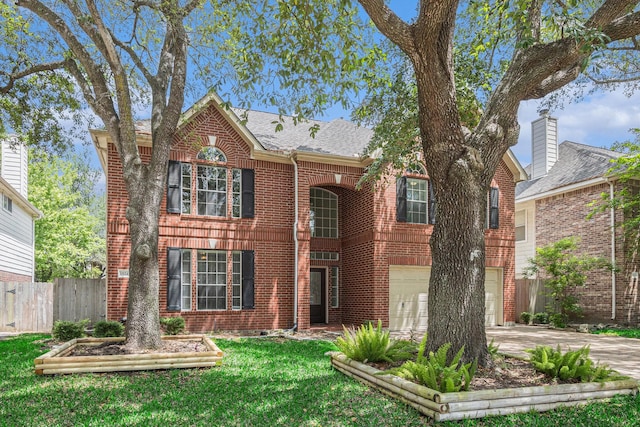 15242 Shapiro Springs Ln, Houston, TX 77095 - colonial home with concrete driveway, brick siding, a garage, and a shingled roof