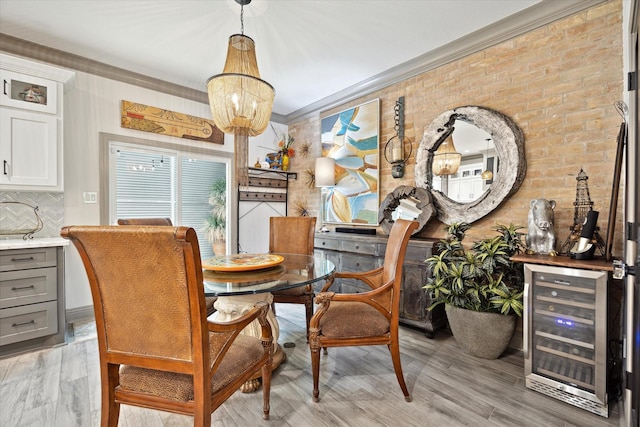 7 Woodstone St, Houston, TX 77024 - dining room with wine cooler, crown molding, and a chandelier