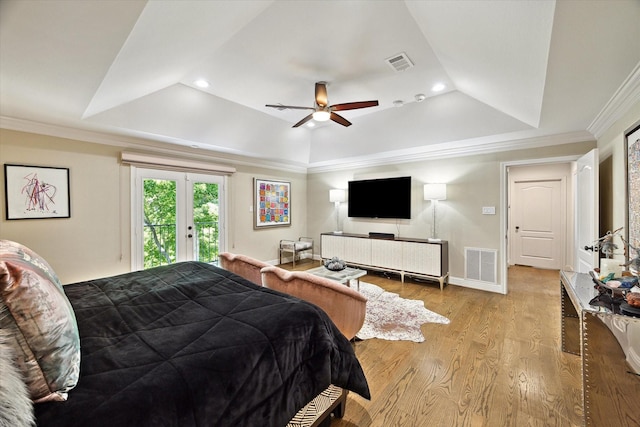 7 Woodstone St, Houston, TX 77024 - bedroom featuring access to outside, wood finished floors, french doors, a tray ceiling, and recessed lighting