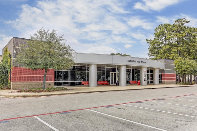 7 Woodstone St, Houston, TX 77024 - view of building exterior featuring uncovered parking