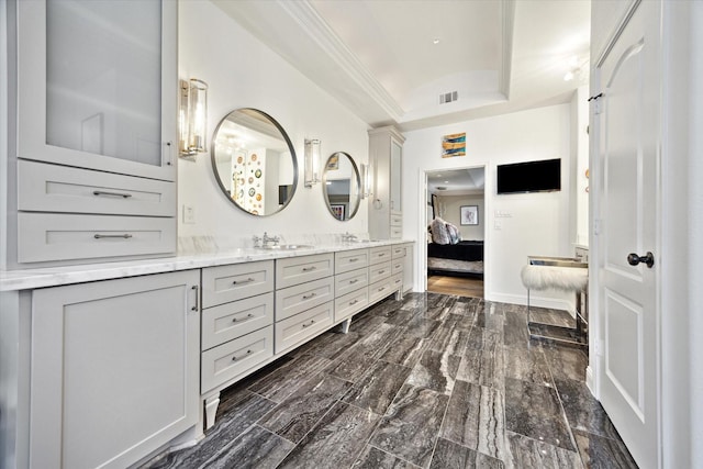 7 Woodstone St, Houston, TX 77024 - ensuite bathroom with a raised ceiling and double vanity
