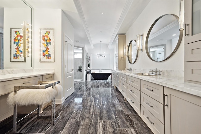 7 Woodstone St, Houston, TX 77024 - bathroom with double vanity, ornamental molding, a chandelier, wood finished floors, and baseboards