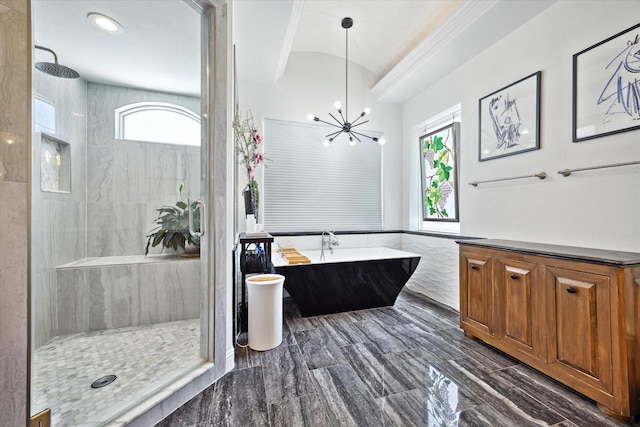 7 Woodstone St, Houston, TX 77024 - full bathroom with a soaking tub, tiled shower, healthy amount of natural light, and a chandelier