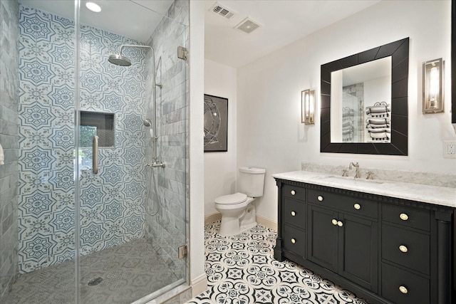 7 Woodstone St, Houston, TX 77024 - full bathroom with toilet, vanity, a shower stall, tile patterned floors, and baseboards